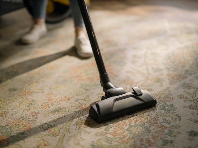 vacuuming carpet