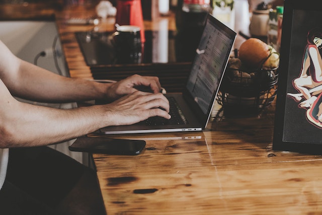 person typing on computer