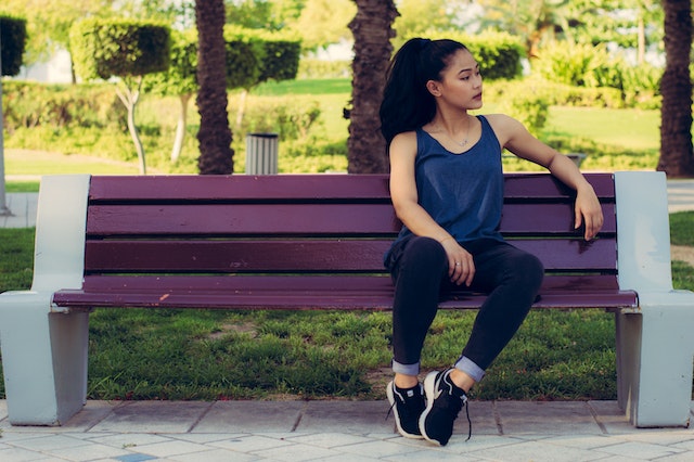 person sitting on a park bench