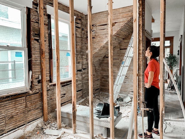 person standing in apartment under construction